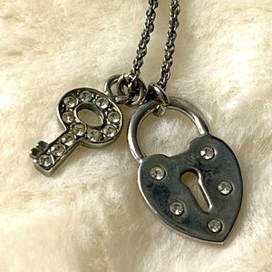 Heart lock and key pendants on silver chain